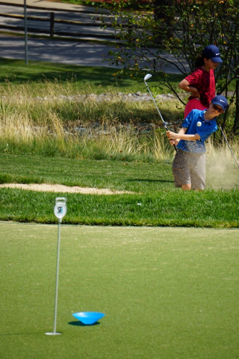 Camp coach providing instruction at KOHR Golf Center